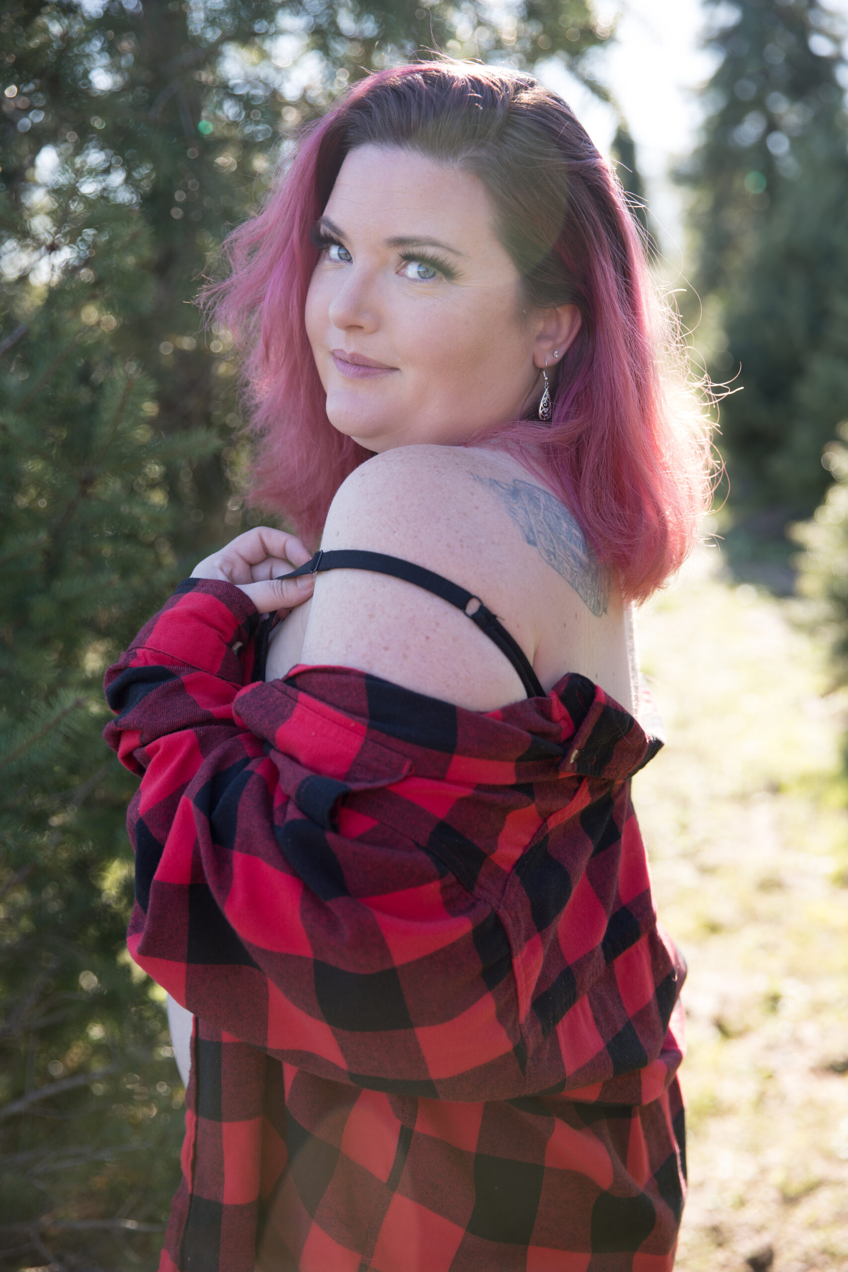 woman looking confident in tree farm