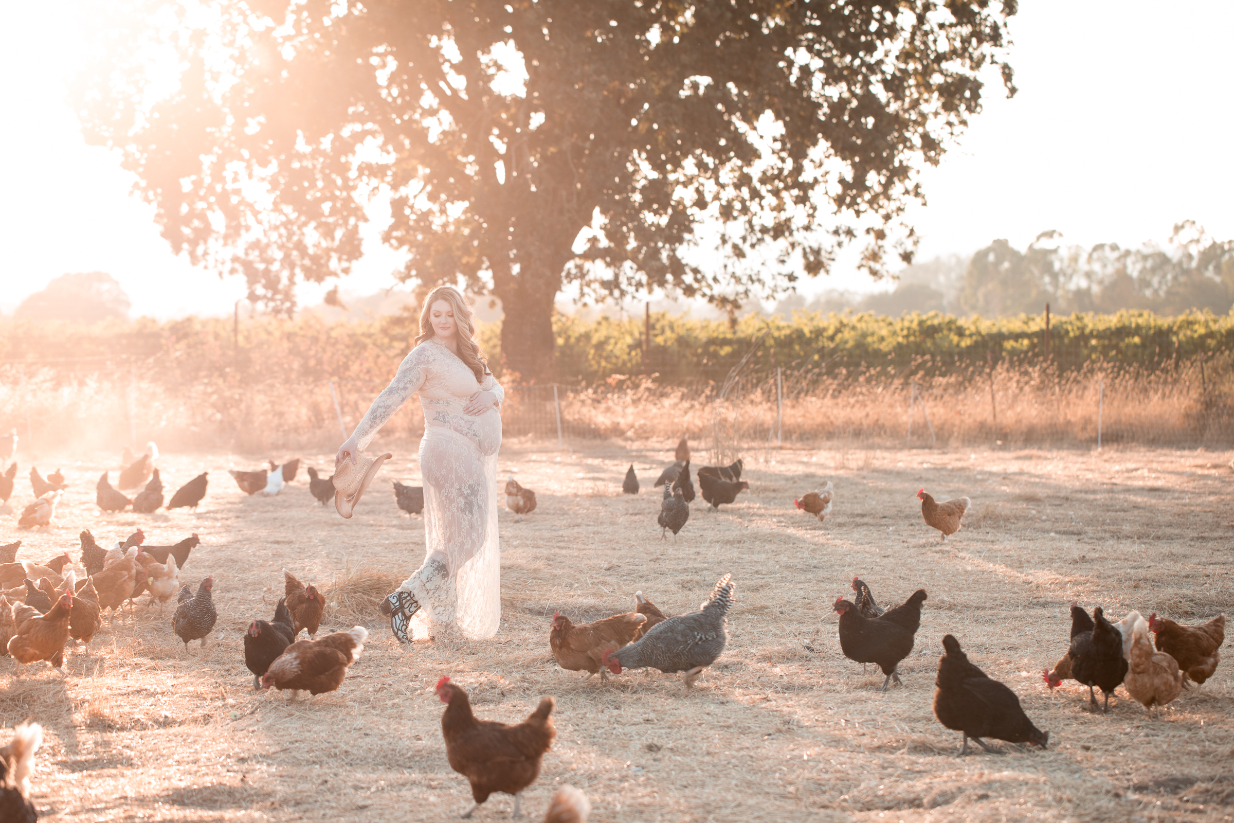 country mama to be with chickens